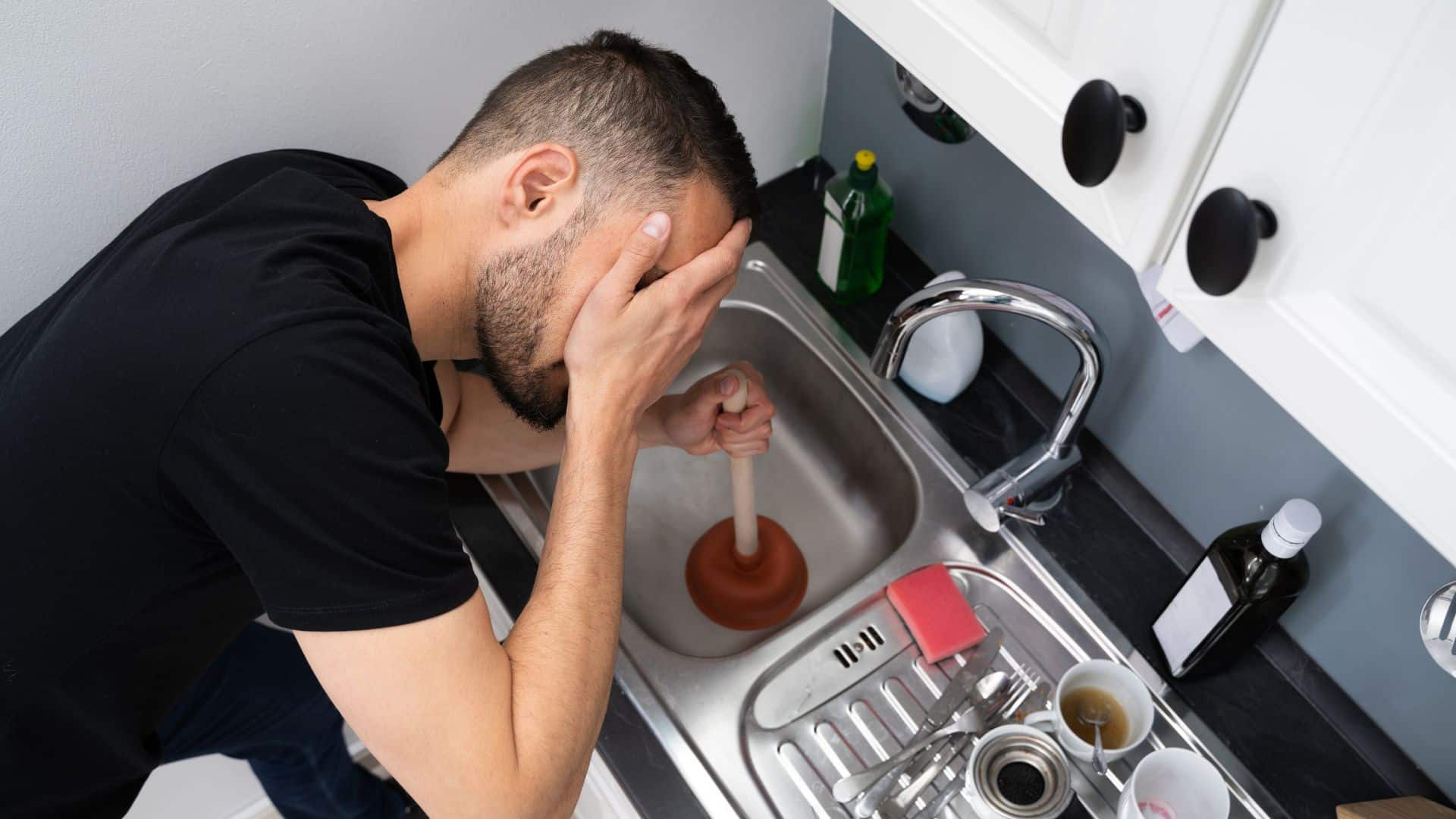 Unclogging the drain.