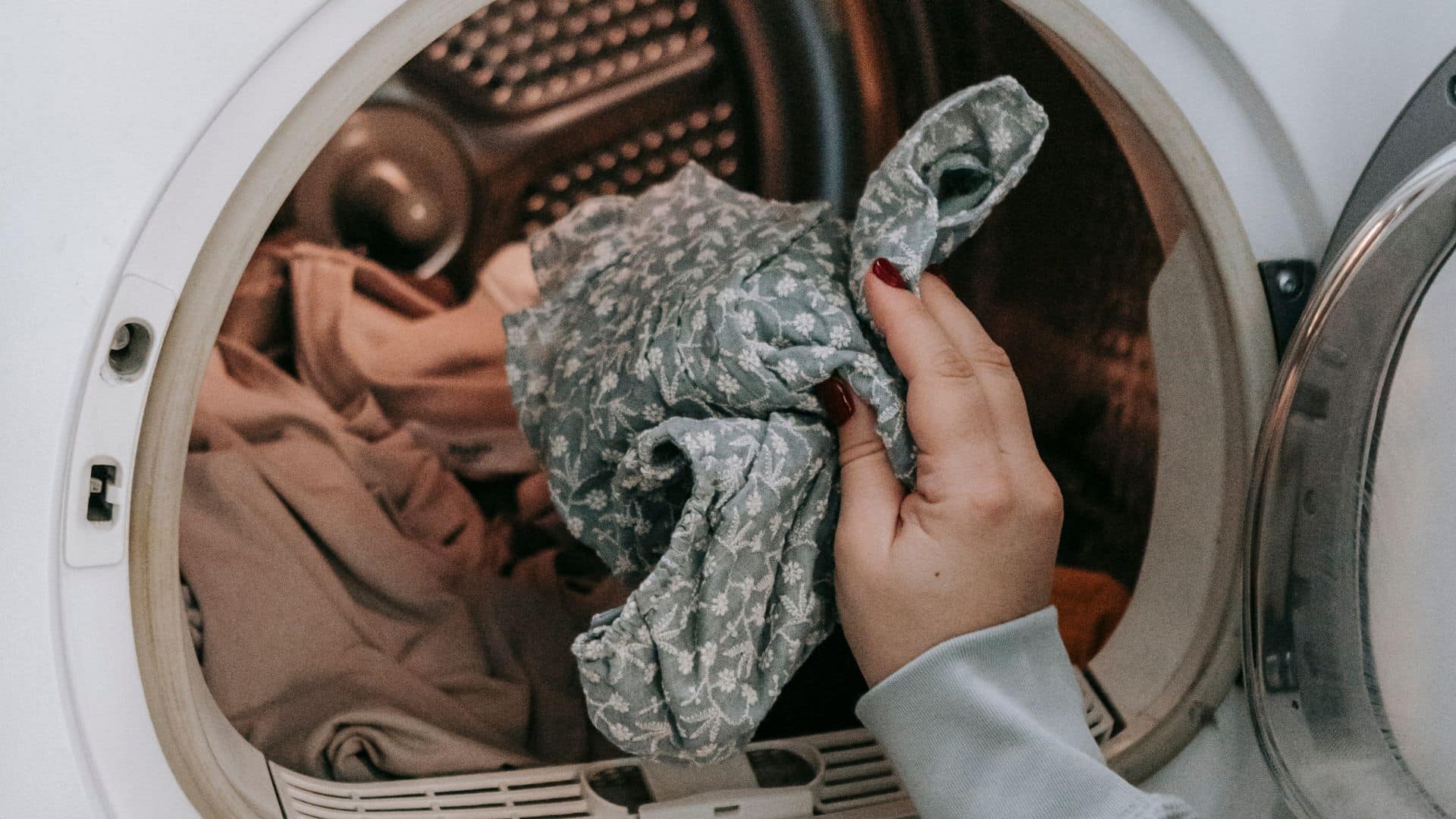 Putting clothes inside the washing machine