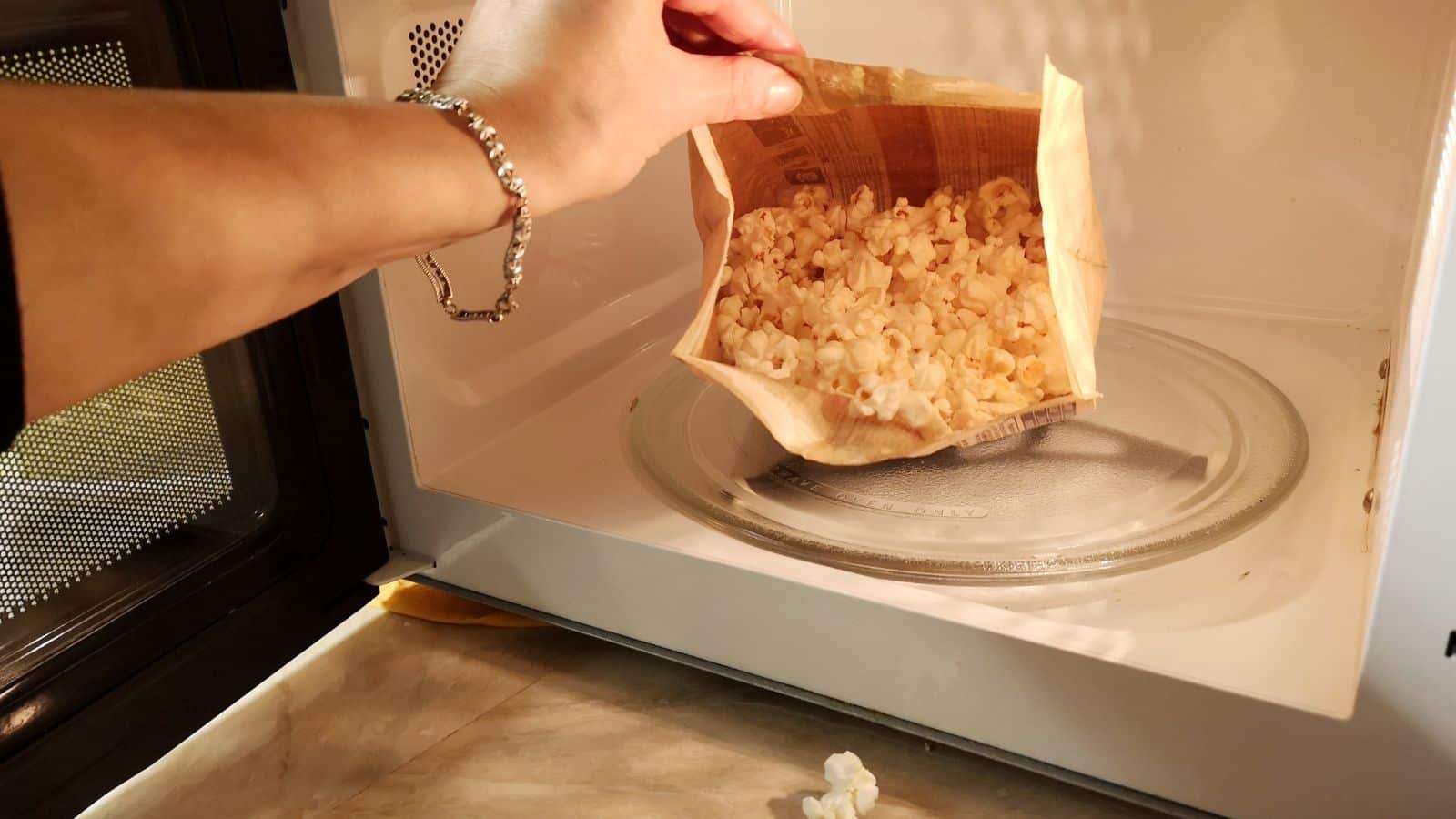 Cooking popcorn in the microwave.